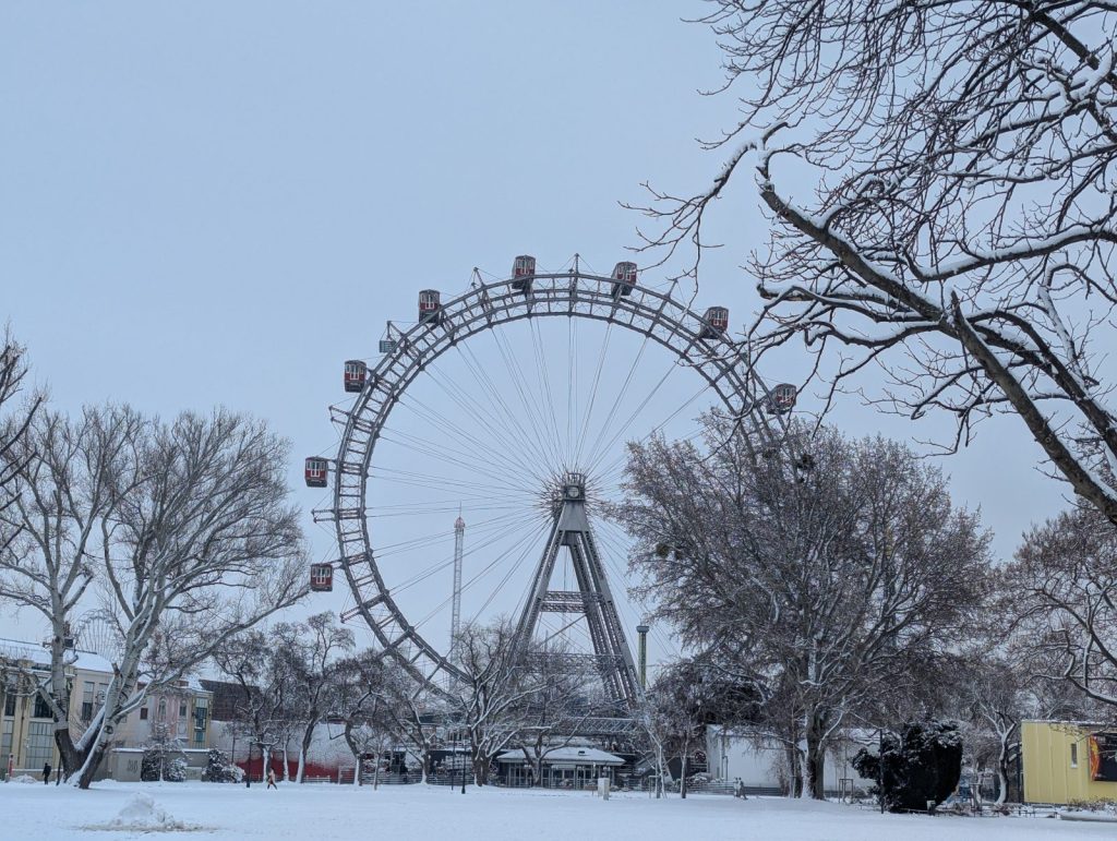 Vienna Prater Ferris wheel in winter with snow-covered paths and trees